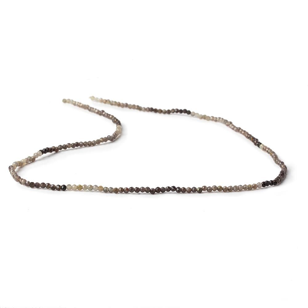 Full 13-inch strand of multi-tonal grey and brown sapphire micro-faceted round beads laid out on a white background.