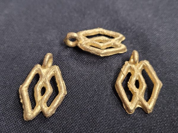 ashanti brass pendant 3 adinkra symbol pendants angled view