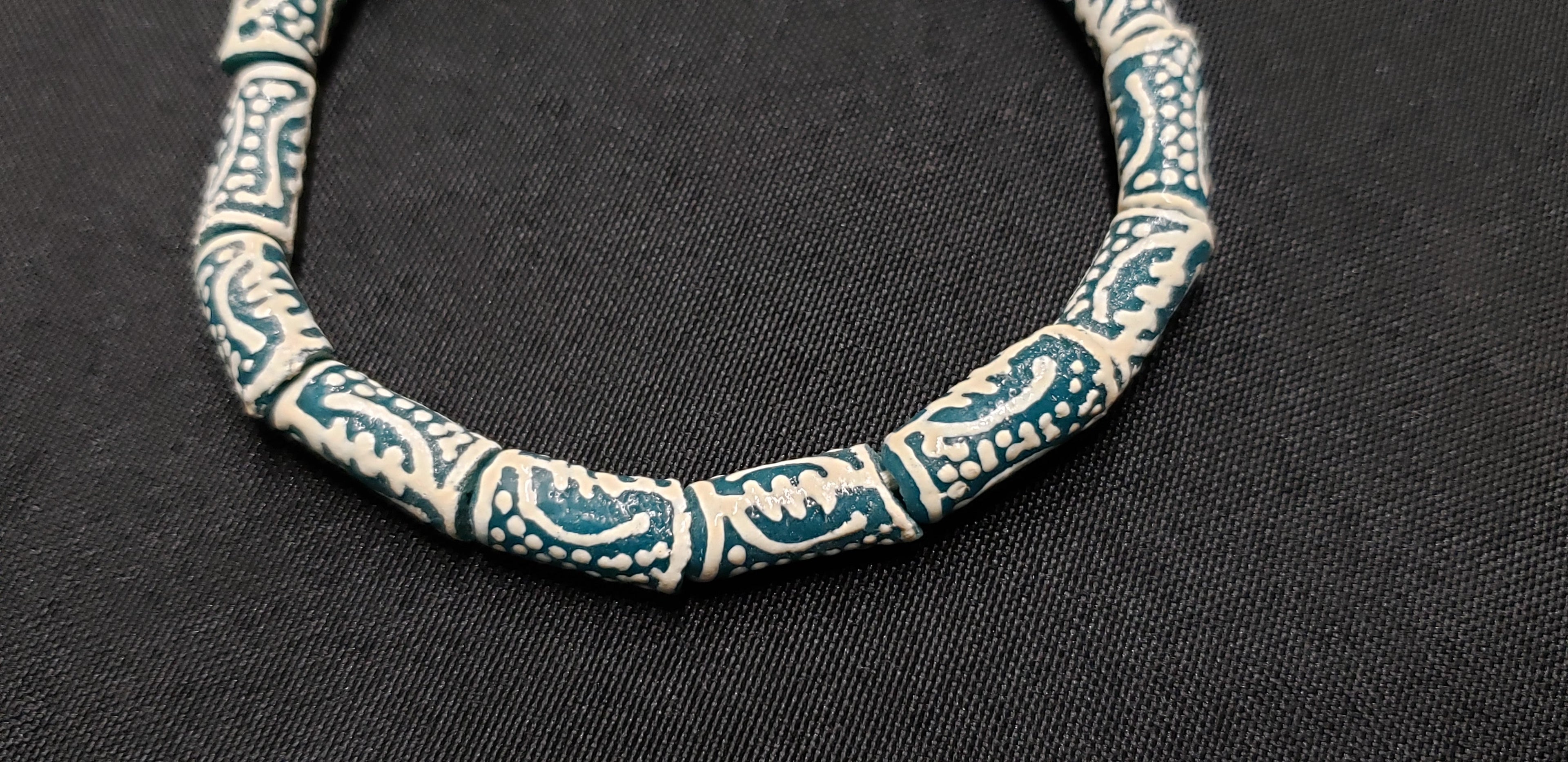 gye nyame african glass beads divine connection close up