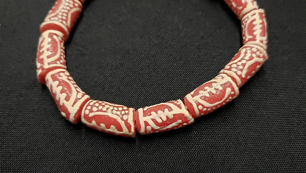 gye nyame glass beads african omnipotence close up