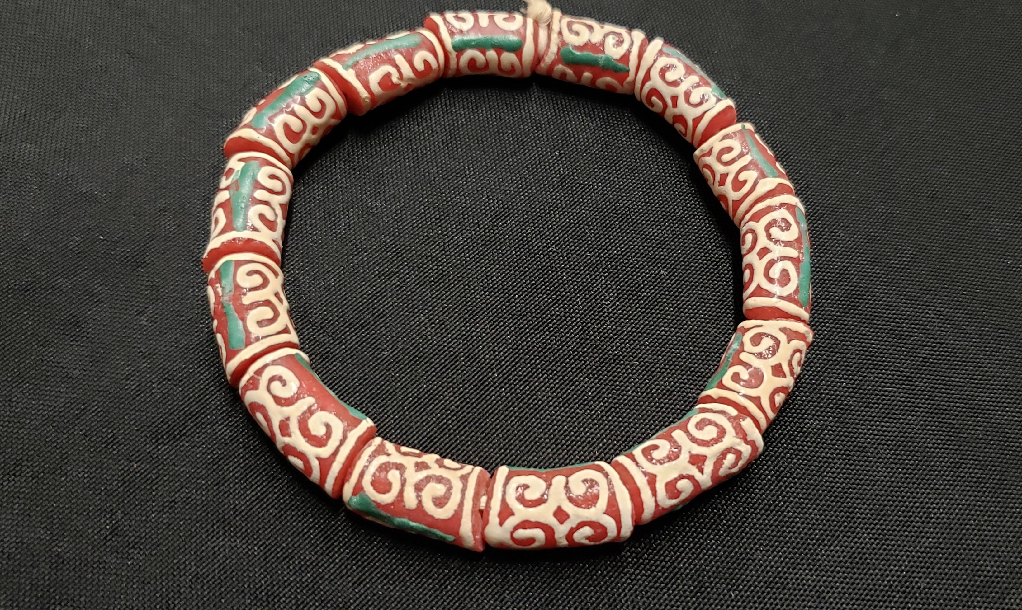 adinkra glass beads AAB#1655 red cream detail view