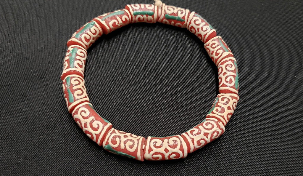 adinkra glass beads AAB#1655 red cream humility strength strand top view