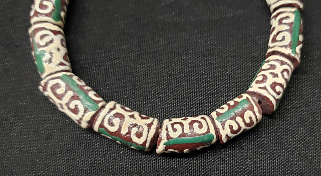 adinkra glass beads AAB#1657 laid flat view