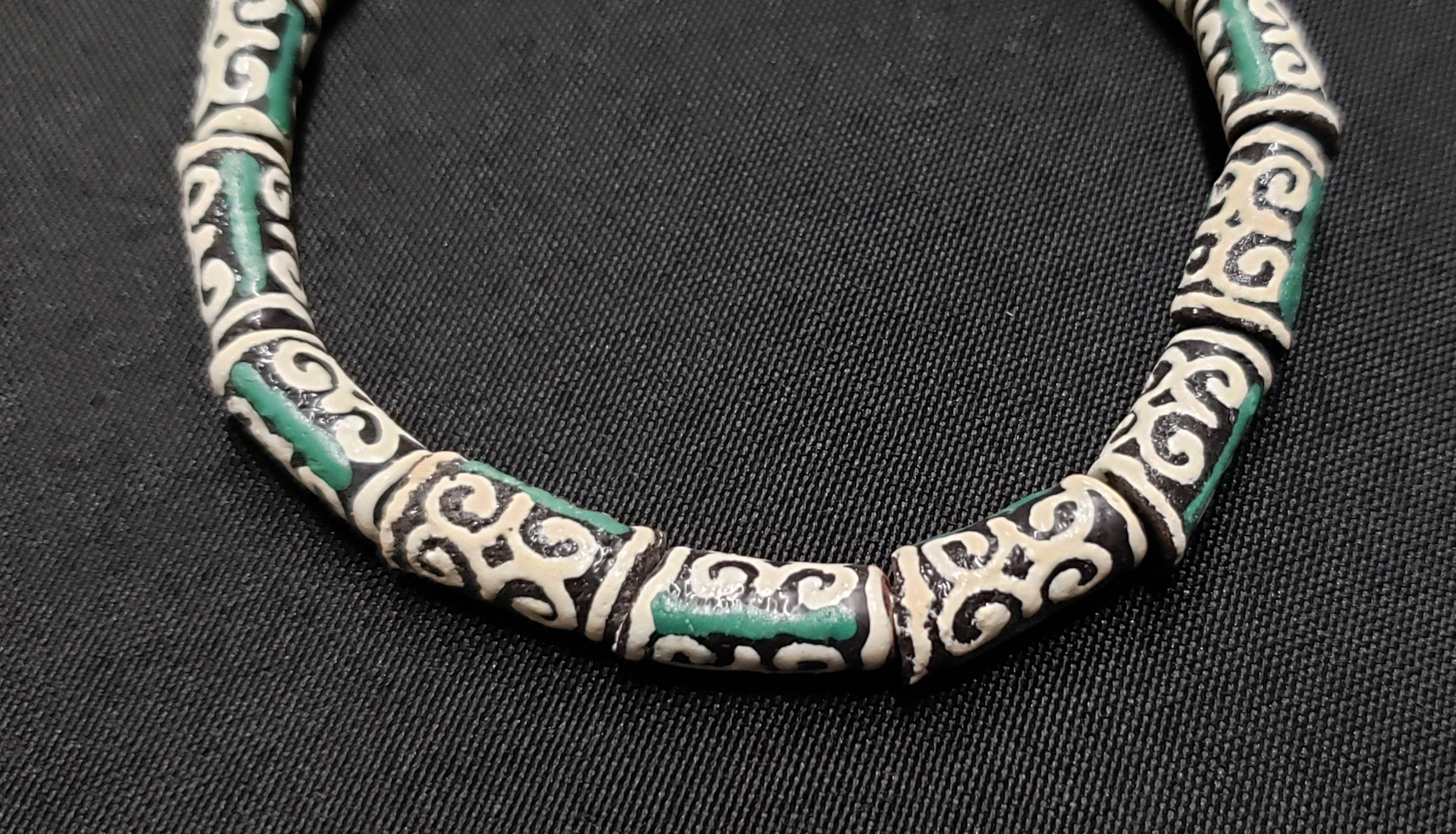 small adinkra glass beads ram horn ghana krobo green cream side view