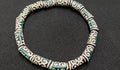 small adinkra glass beads ram horn humility strength ghana krobo green cream strand top view