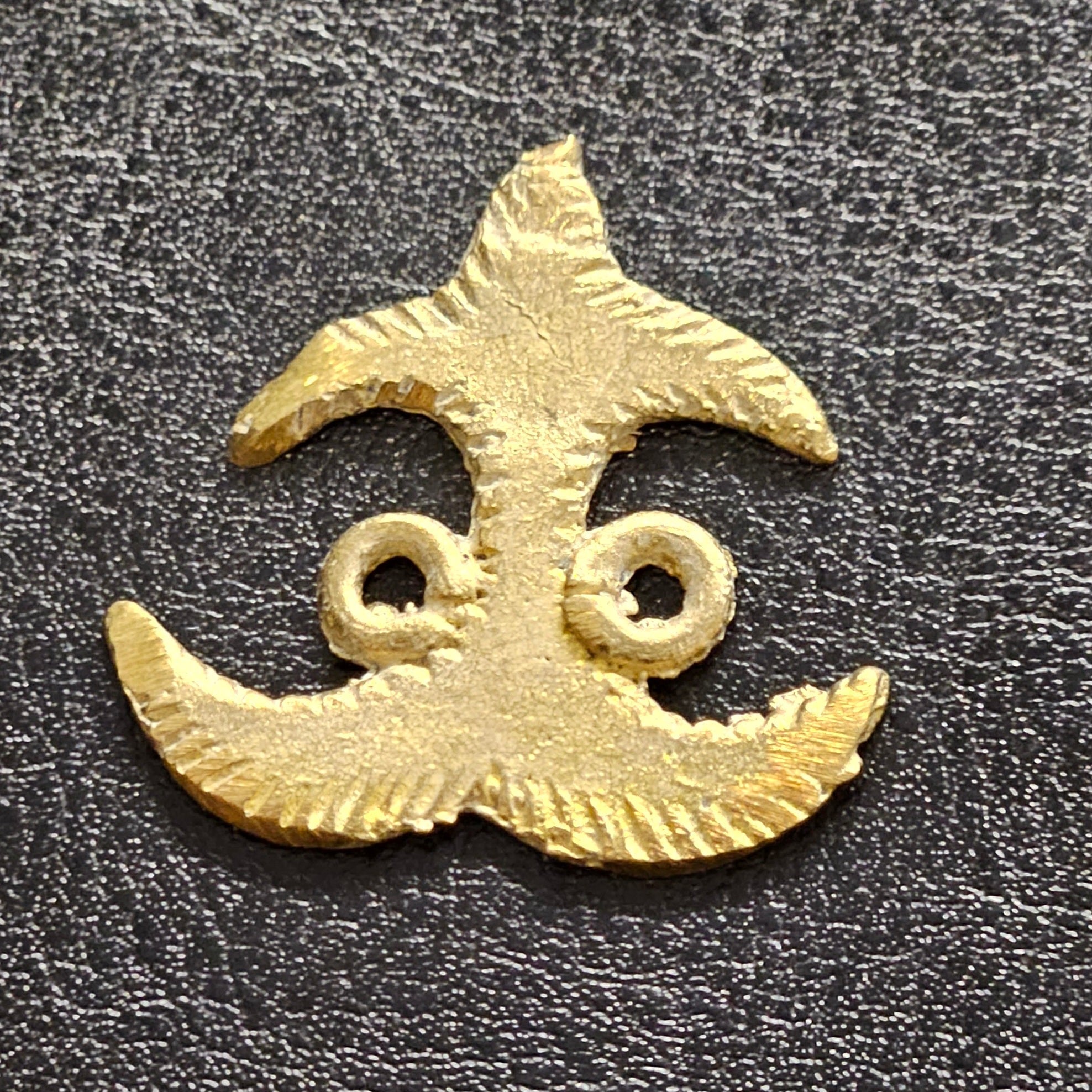 adinkra akokonan african asante brass pendant close up detail