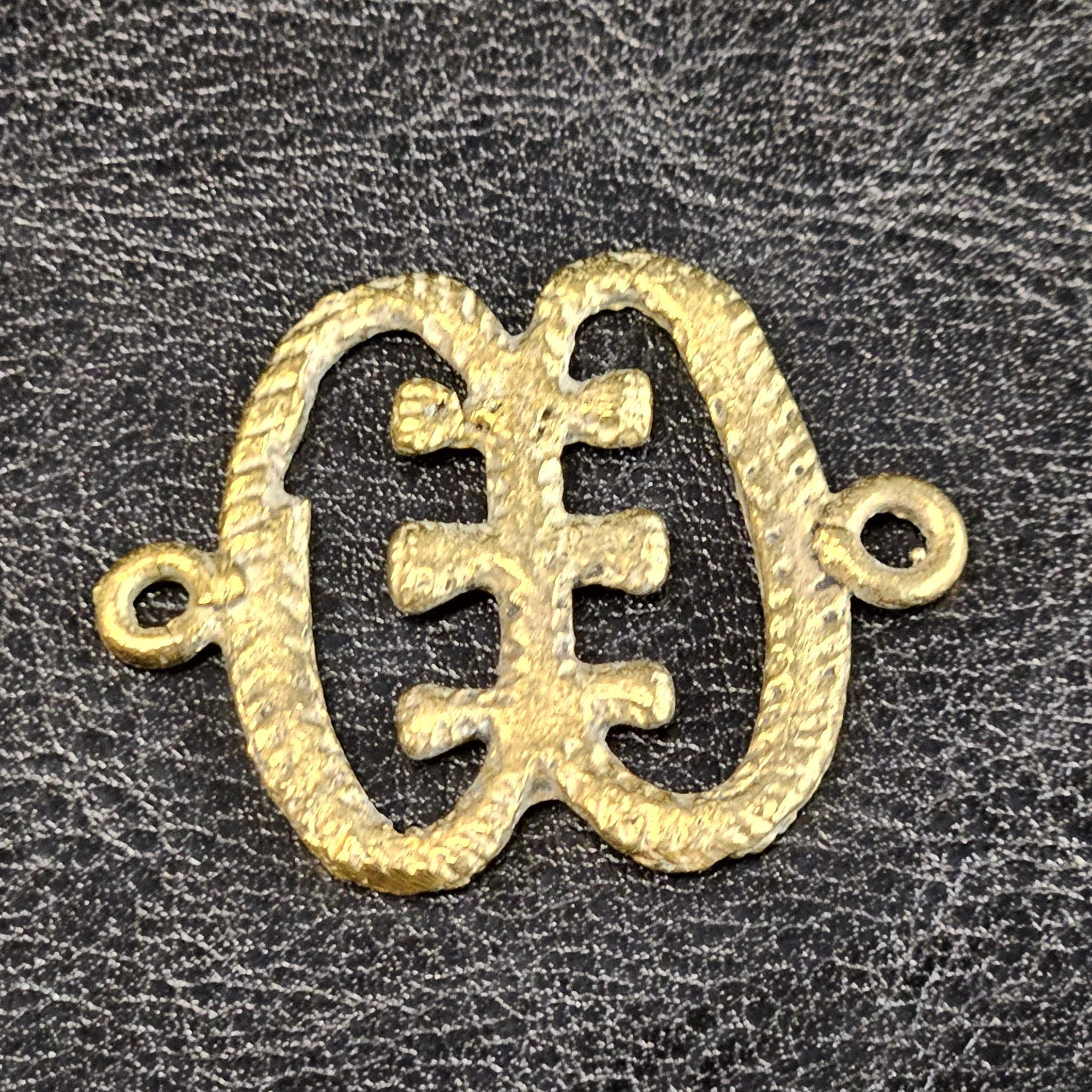 ese ne tekrema adinkra african brass pendant close up detail