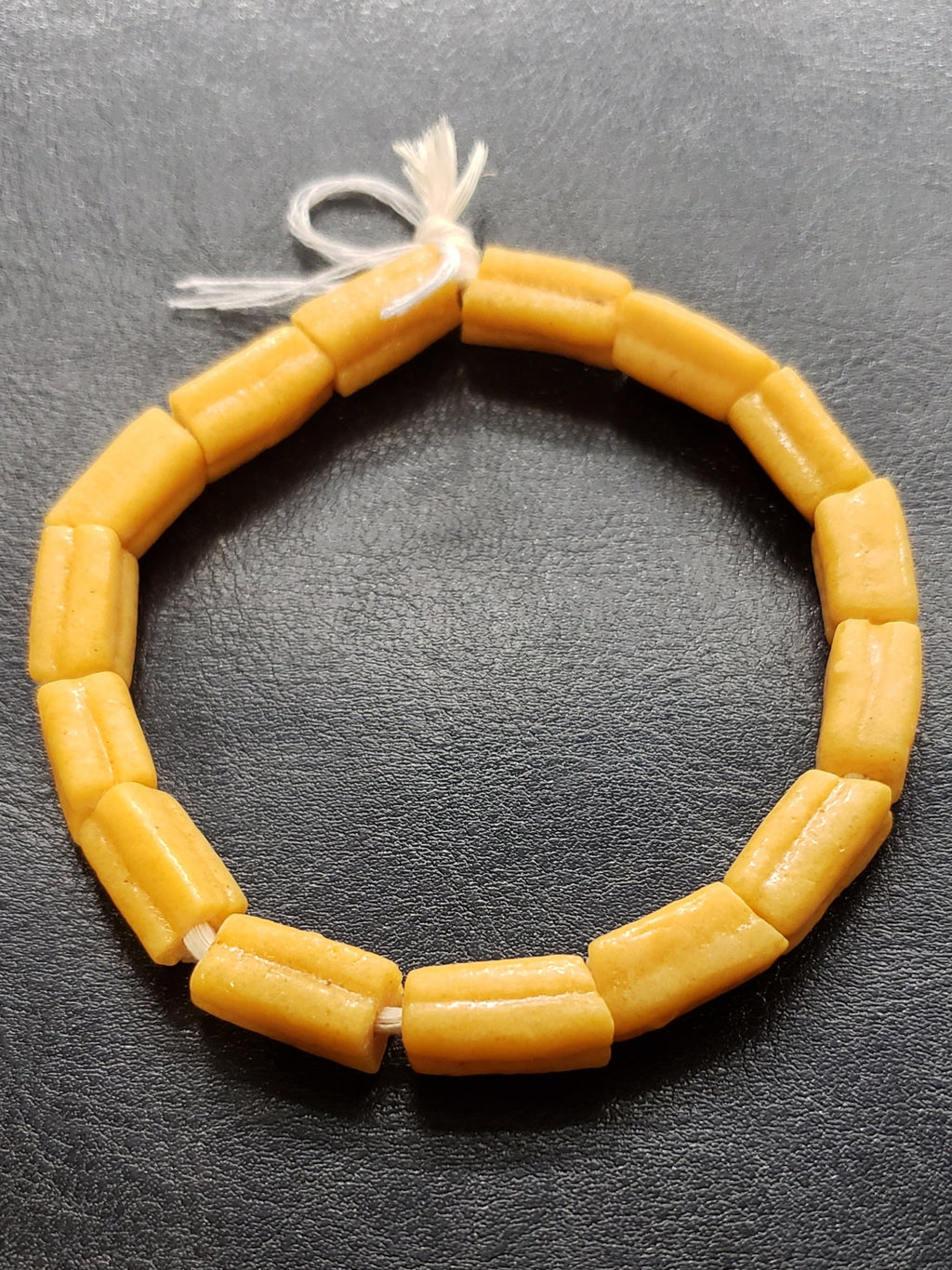 handcrafted krobo tube glass beads angled view