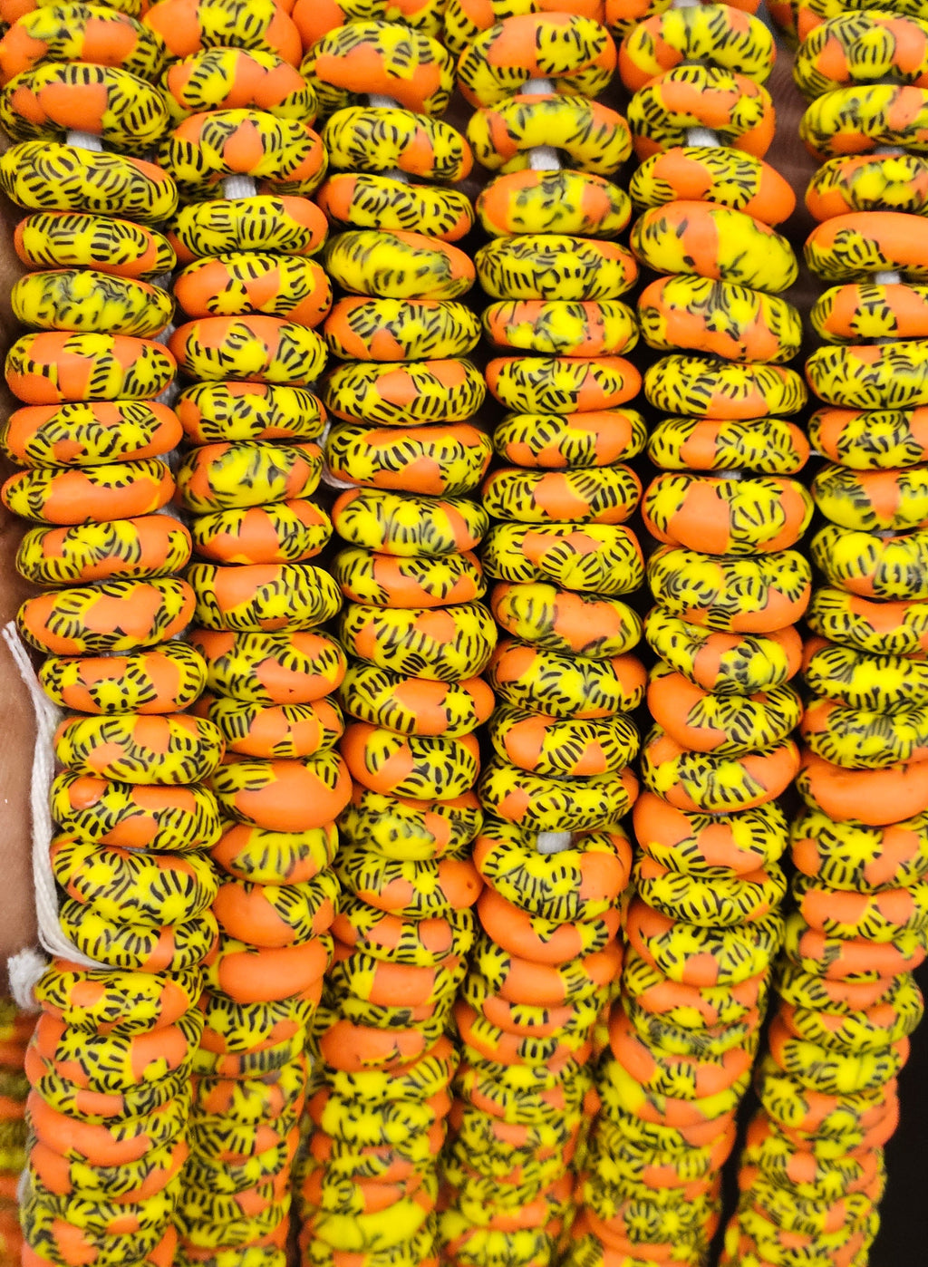 orange yellow krobo rondelle beads strand detail view