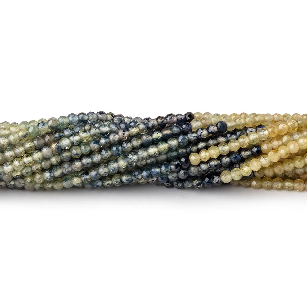 Coiled strands of multi color fancy sapphire micro-faceted rondelle beads on a white background.