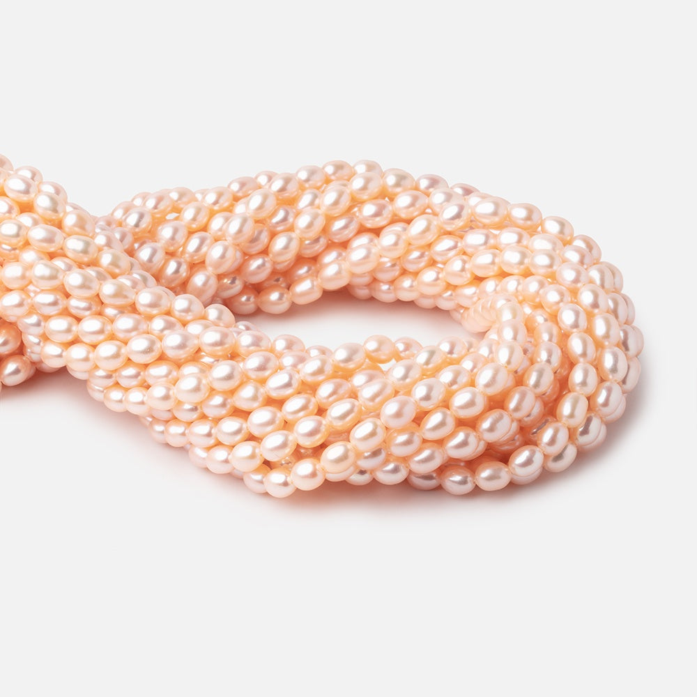 Peach Oval Freshwater Pearl Strand – 7 × 5mm, 15 Inch