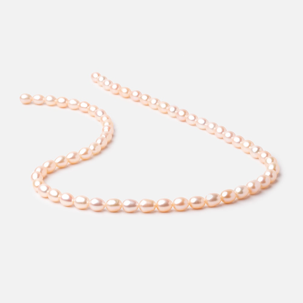 Peach Oval Freshwater Pearl Strand – 7 × 5mm, 15 Inch