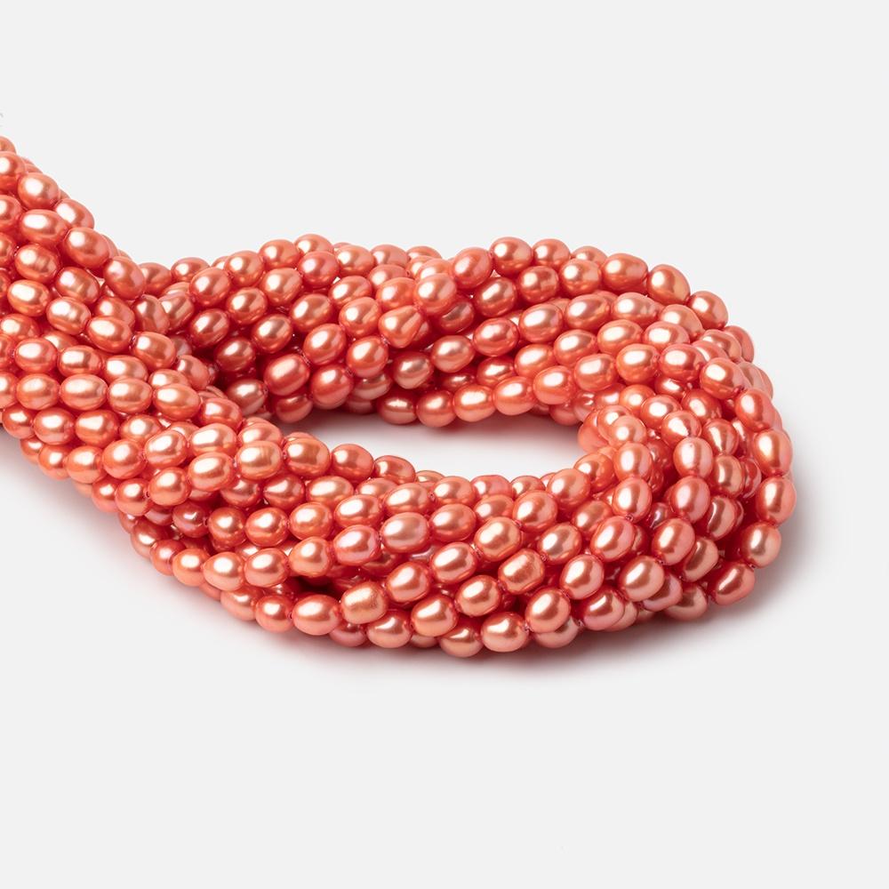 Coral Oval Freshwater Pearl Strand – 6 × 5mm, 15.5 Inch