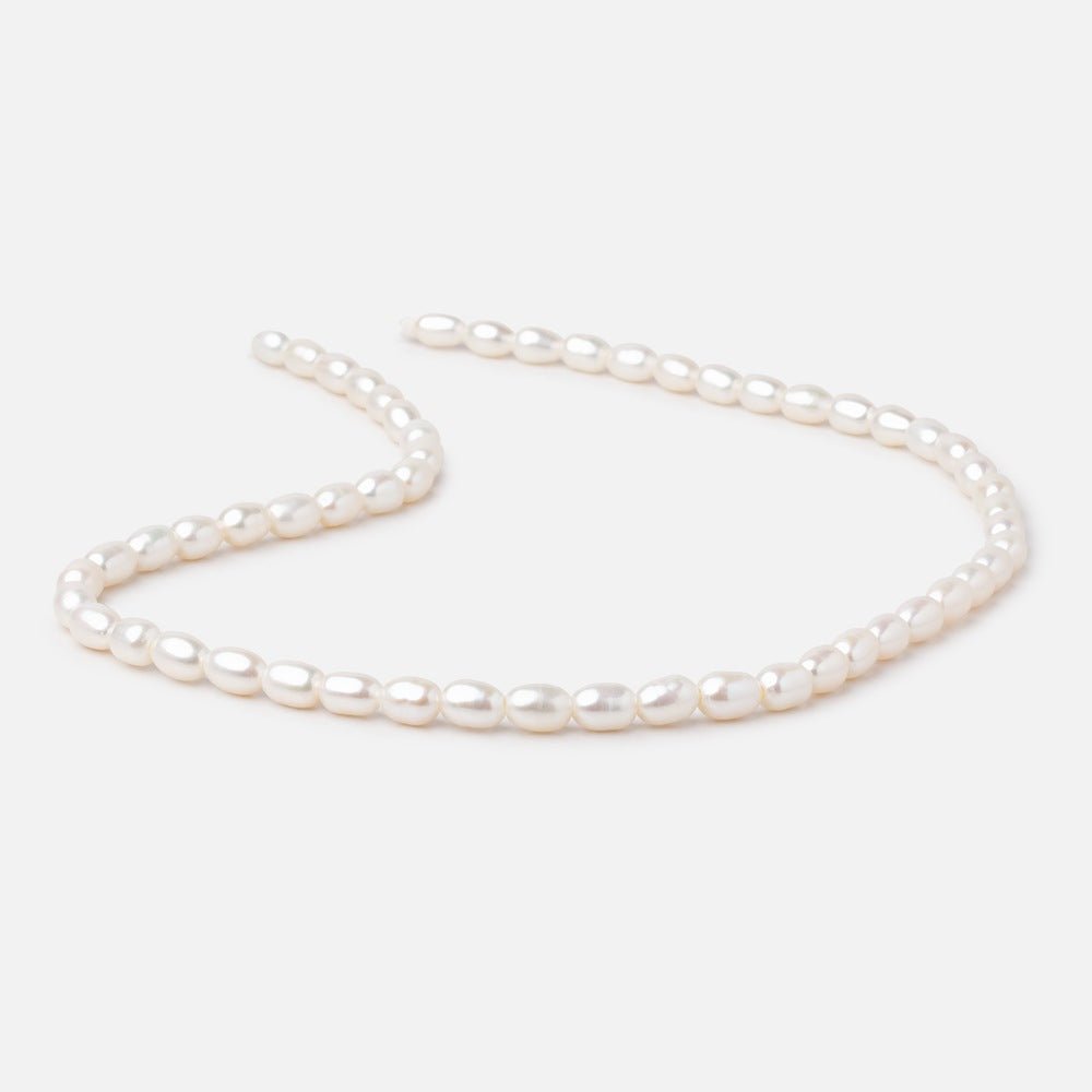 Cream Large-Hole Oval Freshwater Pearl Strand – 5 × 7mm, 16 Inch