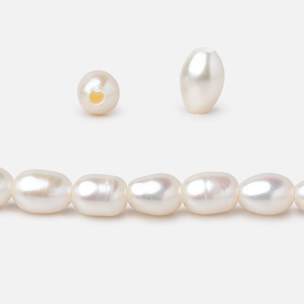 Cream Large-Hole Oval Freshwater Pearl Strand – 5 × 7mm, 16 Inch