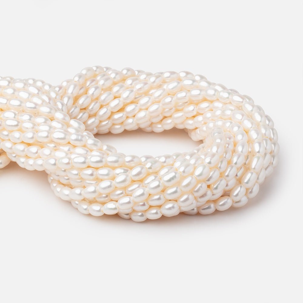 Cream Large-Hole Oval Freshwater Pearl Strand – 5 × 7mm, 16 Inch