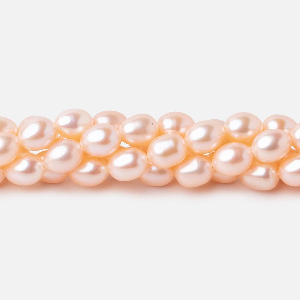 Peach Oval Freshwater Pearl Strand – 7 × 5mm, 15 Inch