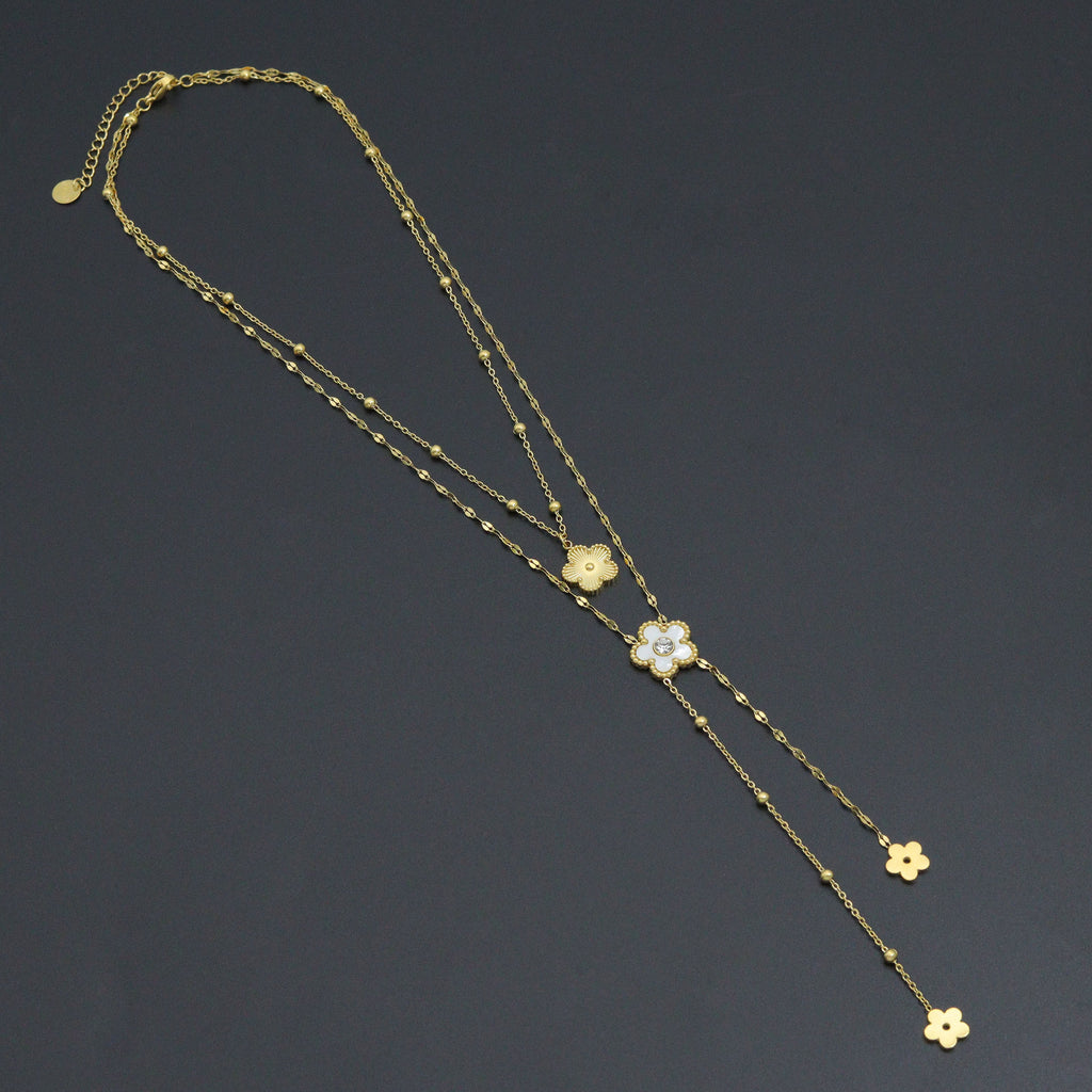 Layered gold-tone flower necklace with two chains and dangling flower charms