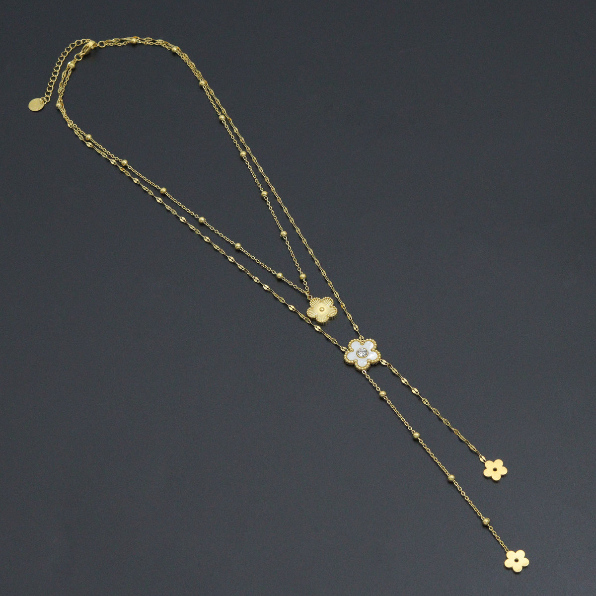 Layered gold-tone flower necklace with two chains and dangling flower charms