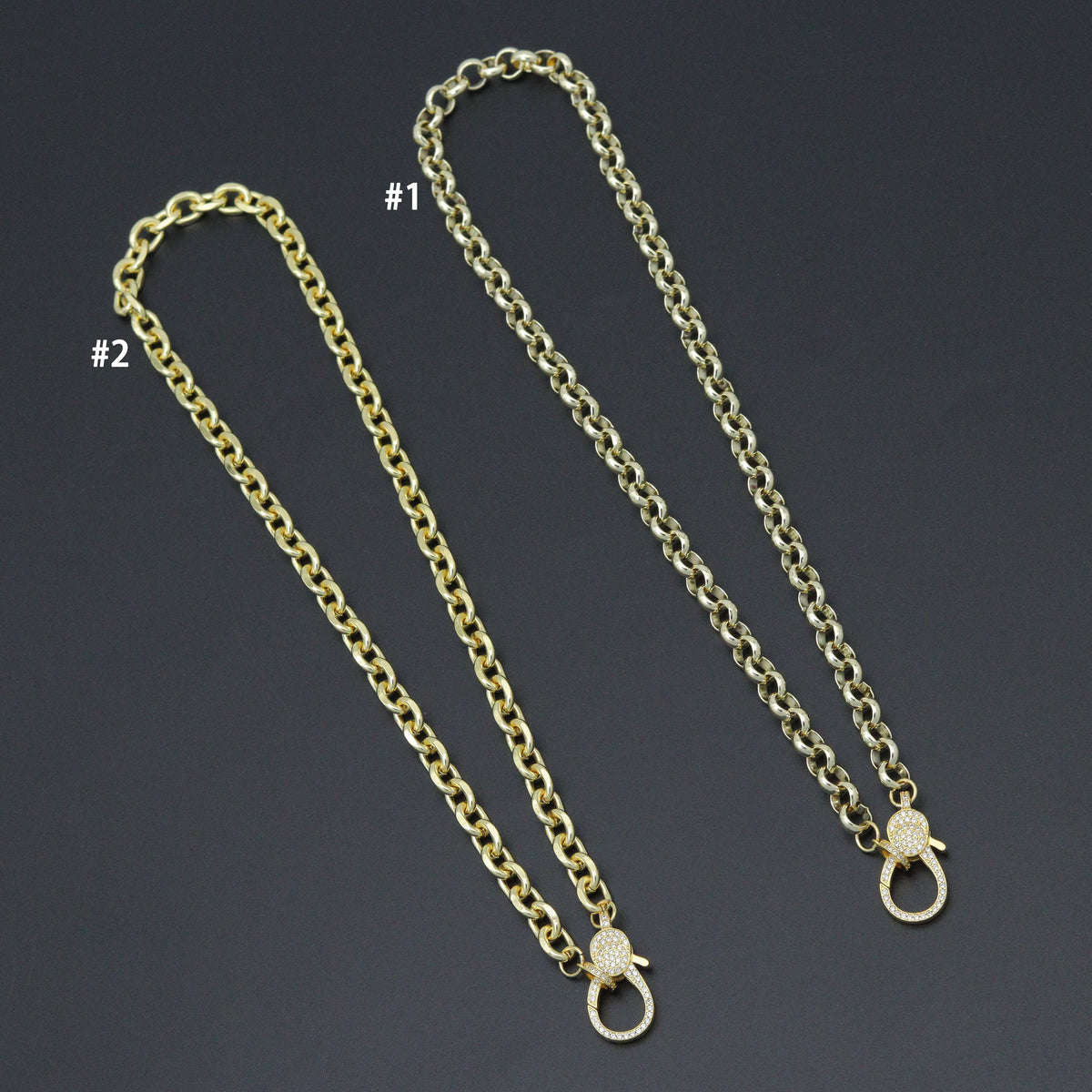 Two thick rolo-link necklaces with large clear-stone lobster clasps, labeled styles 1 and 2