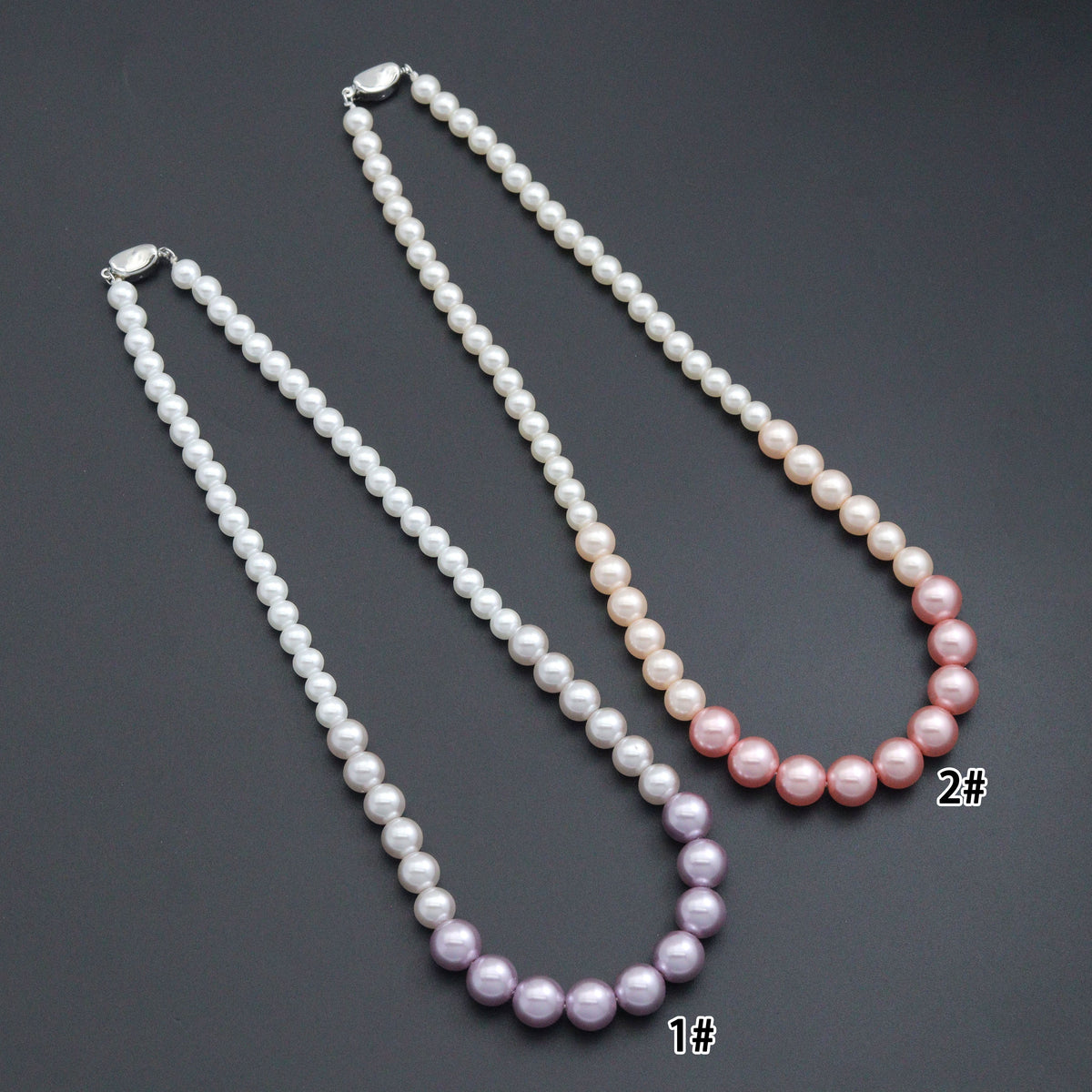 Pink and purple gradient pearl bead necklaces with white beads and silver-tone clasps