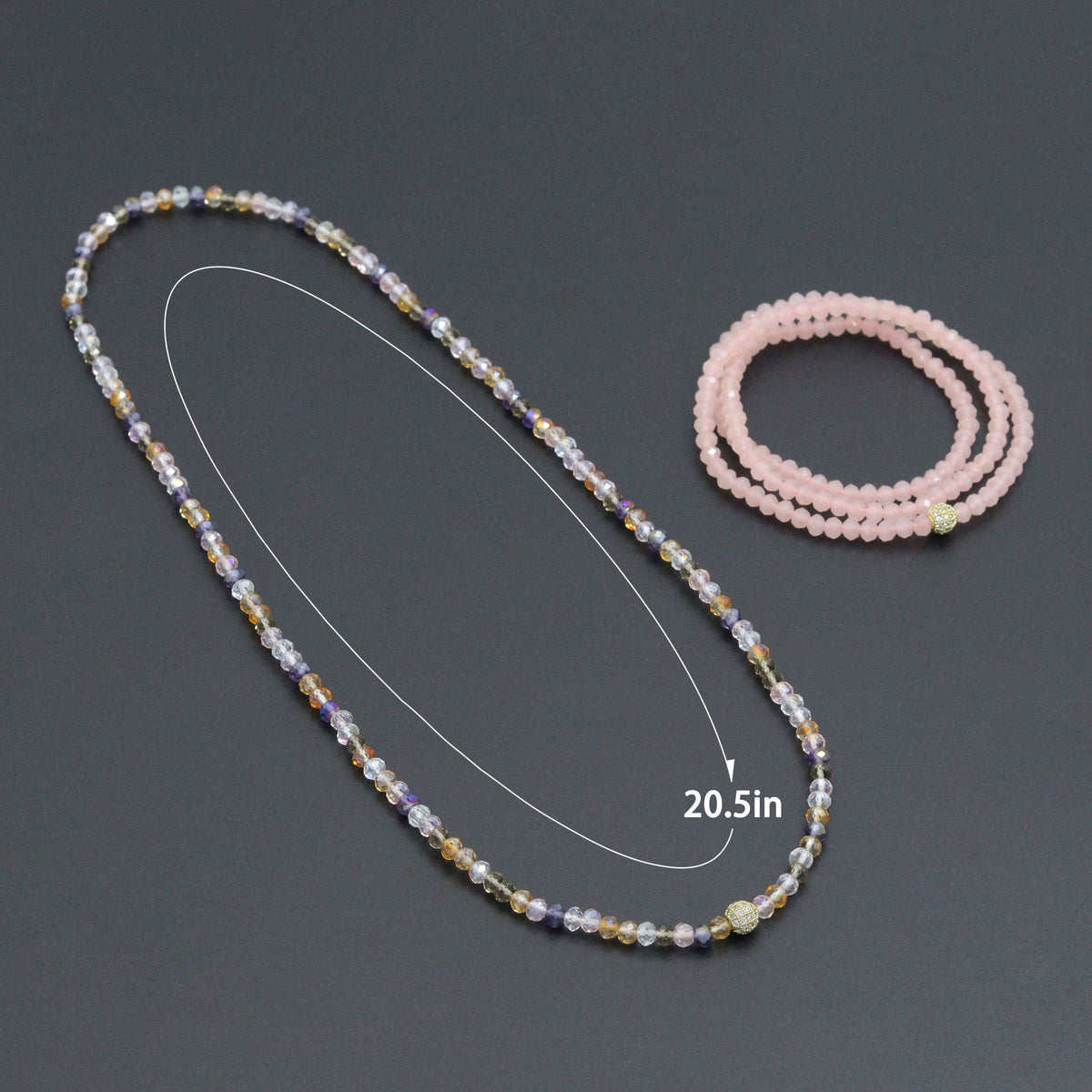 Multicolored crystal bead necklace with a 20.5-inch length diagram beside a pink wrap bracelet