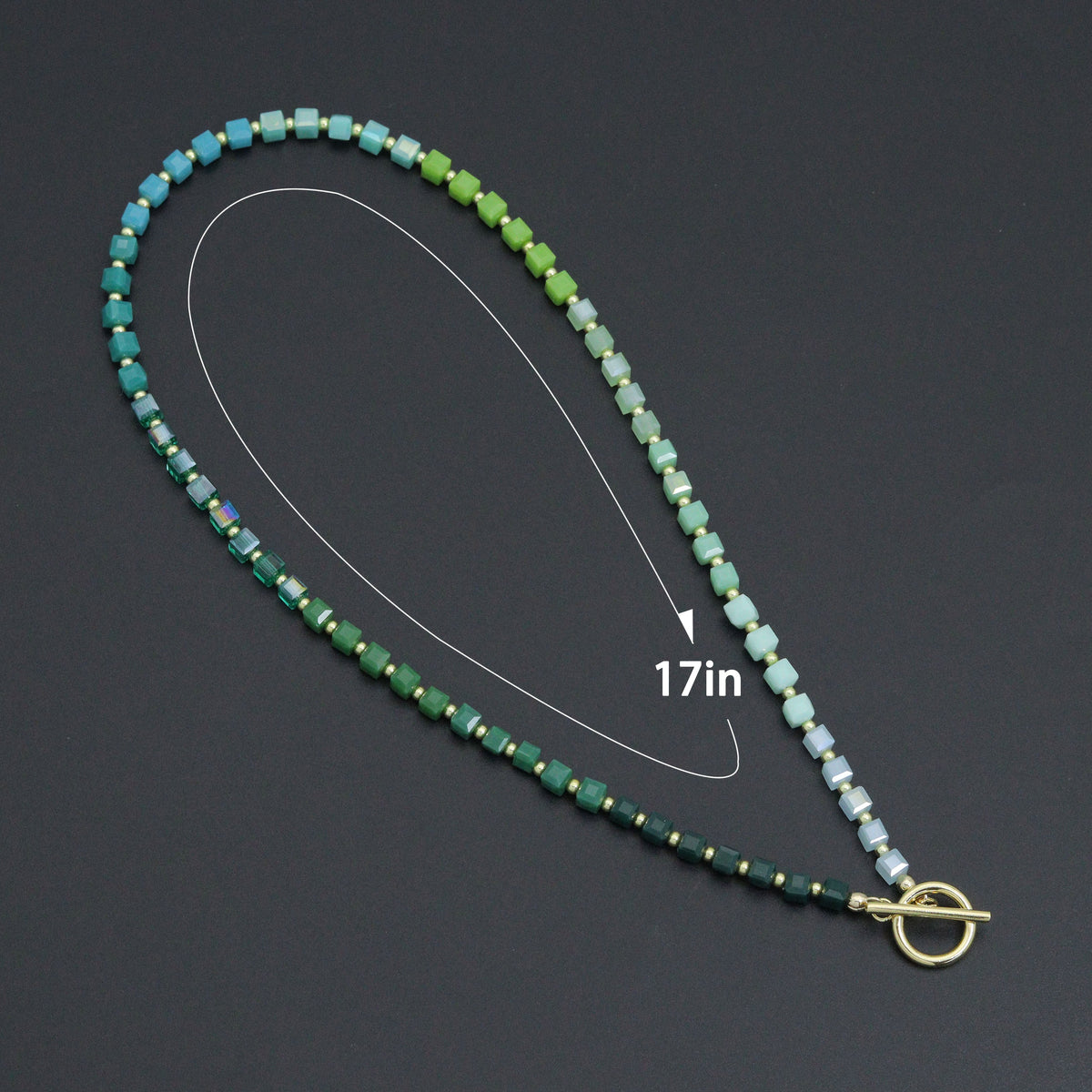 Ombré green cube bead necklace with a diagram indicating a 17-inch length