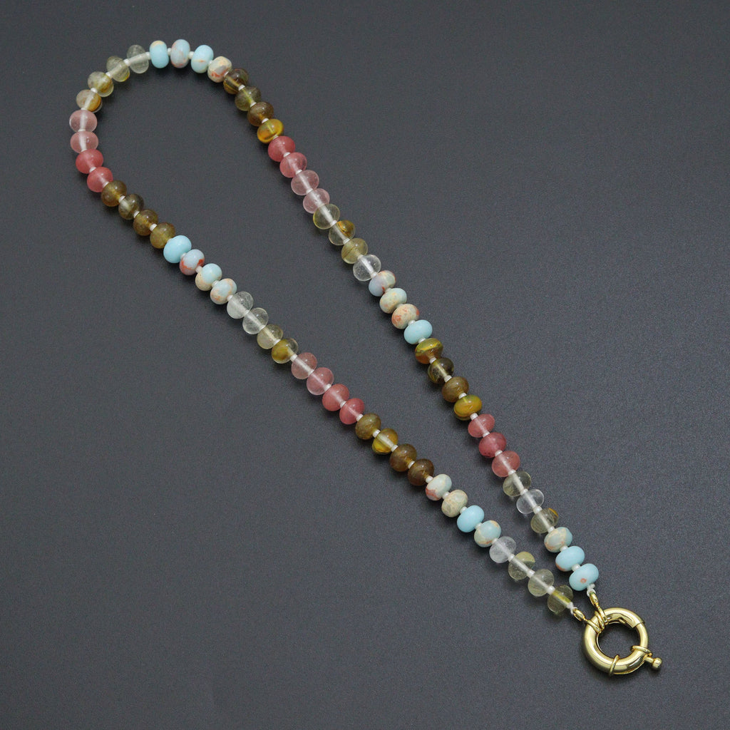 Multicolored rondelle bead necklace with pink, blue, clear and olive beads and a gold-tone round clasp