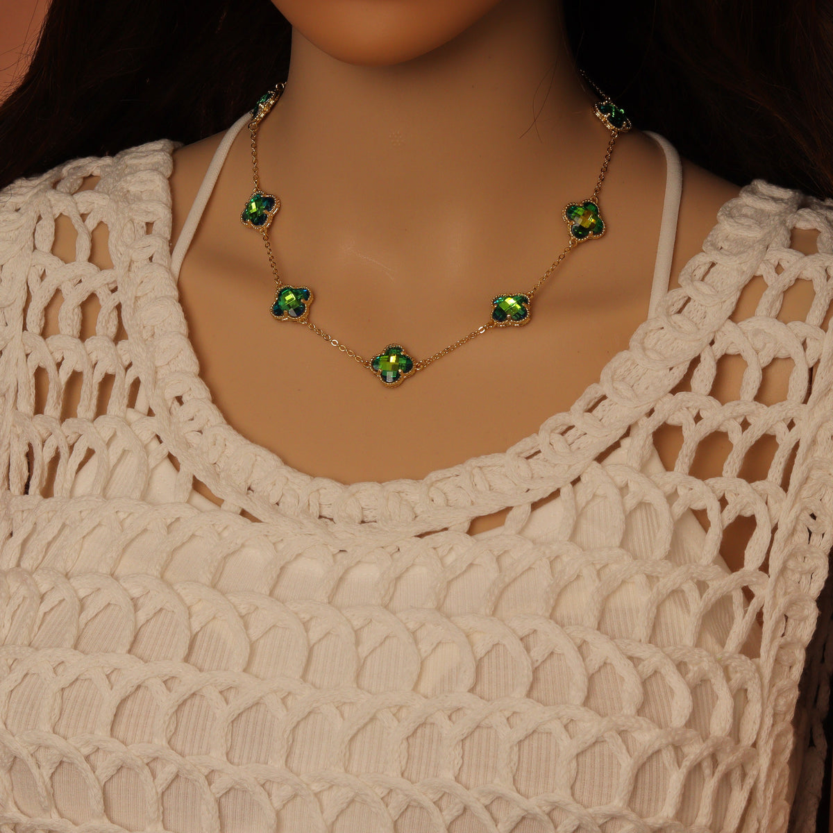 Green iridescent crystal flower necklace worn around the neck
