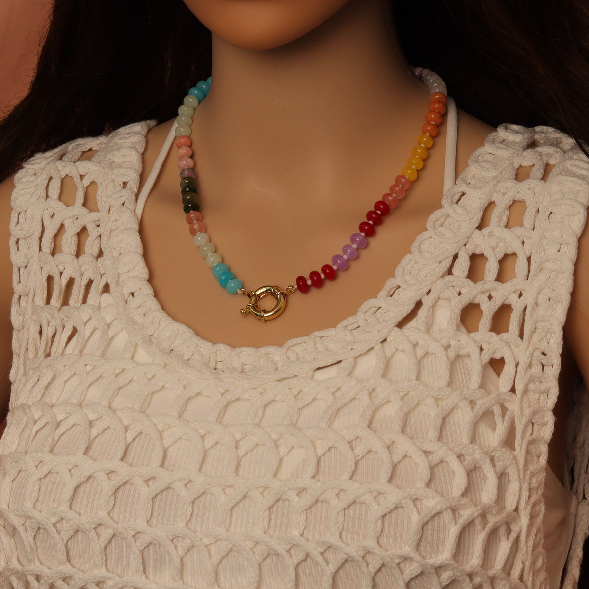 Rainbow rondelle necklace worn with its round clasp at the front