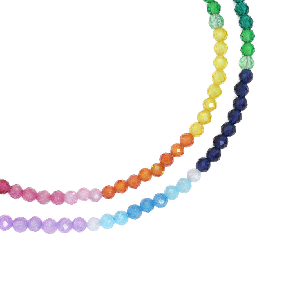 Close-up of rainbow faceted beads in pink, orange, yellow, green, blue and purple