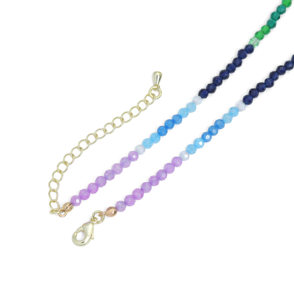 Rainbow bead necklace showing its gold-tone lobster clasp and extender chain