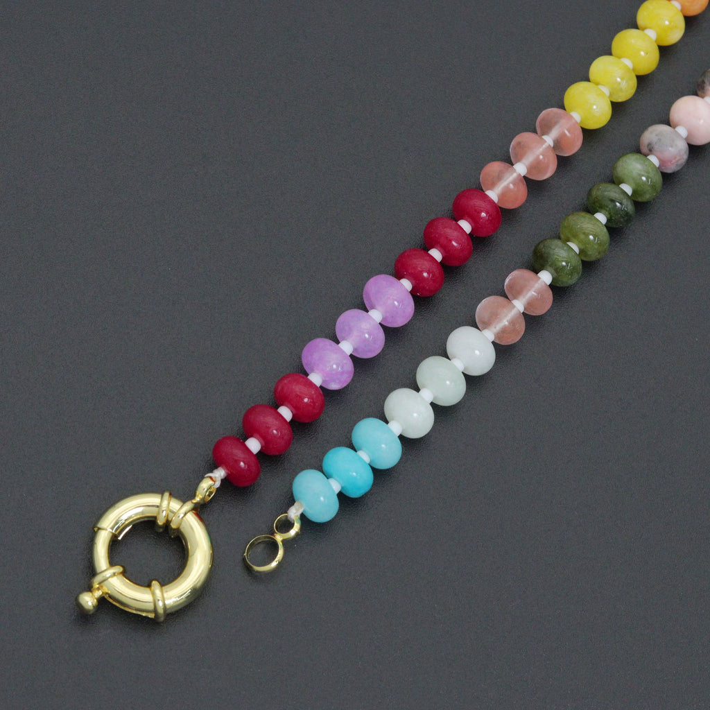 Rainbow bead necklace showing the unfastened gold-tone round clasp