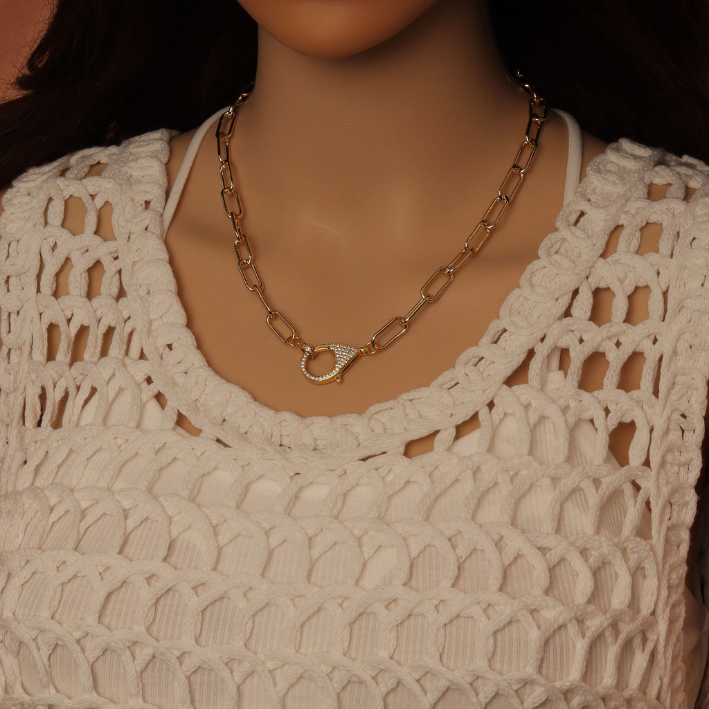 Paperclip-link necklace worn with the sparkling lobster clasp at the front