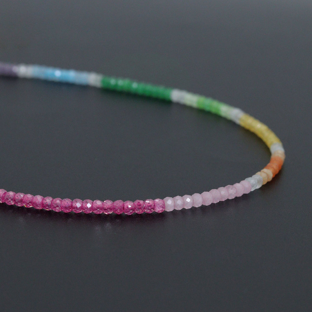 Close-up of the rainbow necklace pink, purple and multicolored faceted beads