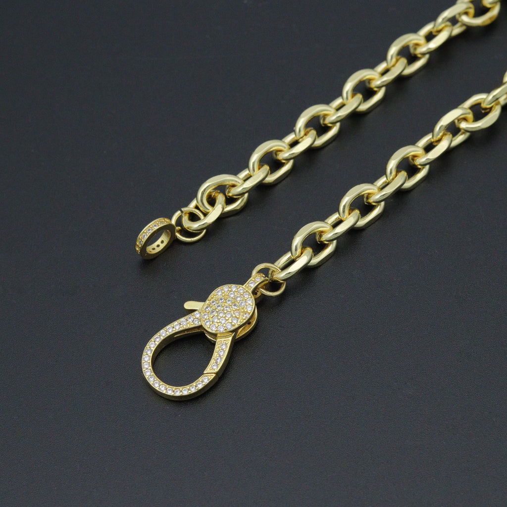 Rolo necklace showing its unfastened clear-stone clasp and matching end ring