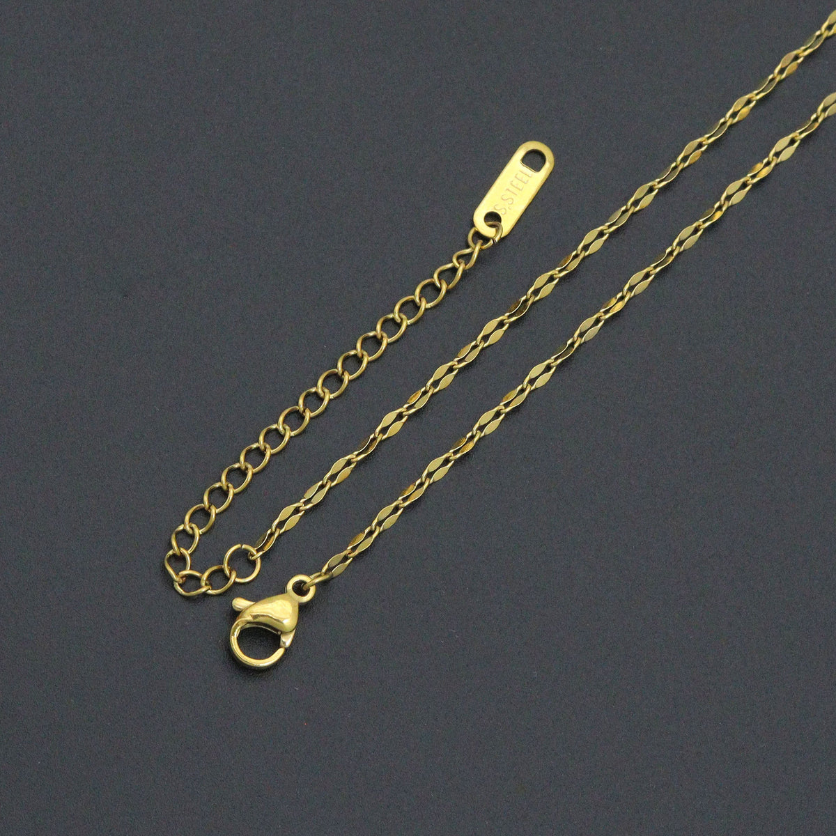 Shell pendant necklace gold-tone lobster clasp and extender chain close-up
