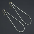 Two white rice-shaped bead necklaces with gold-tone lobster clasps and extender chains