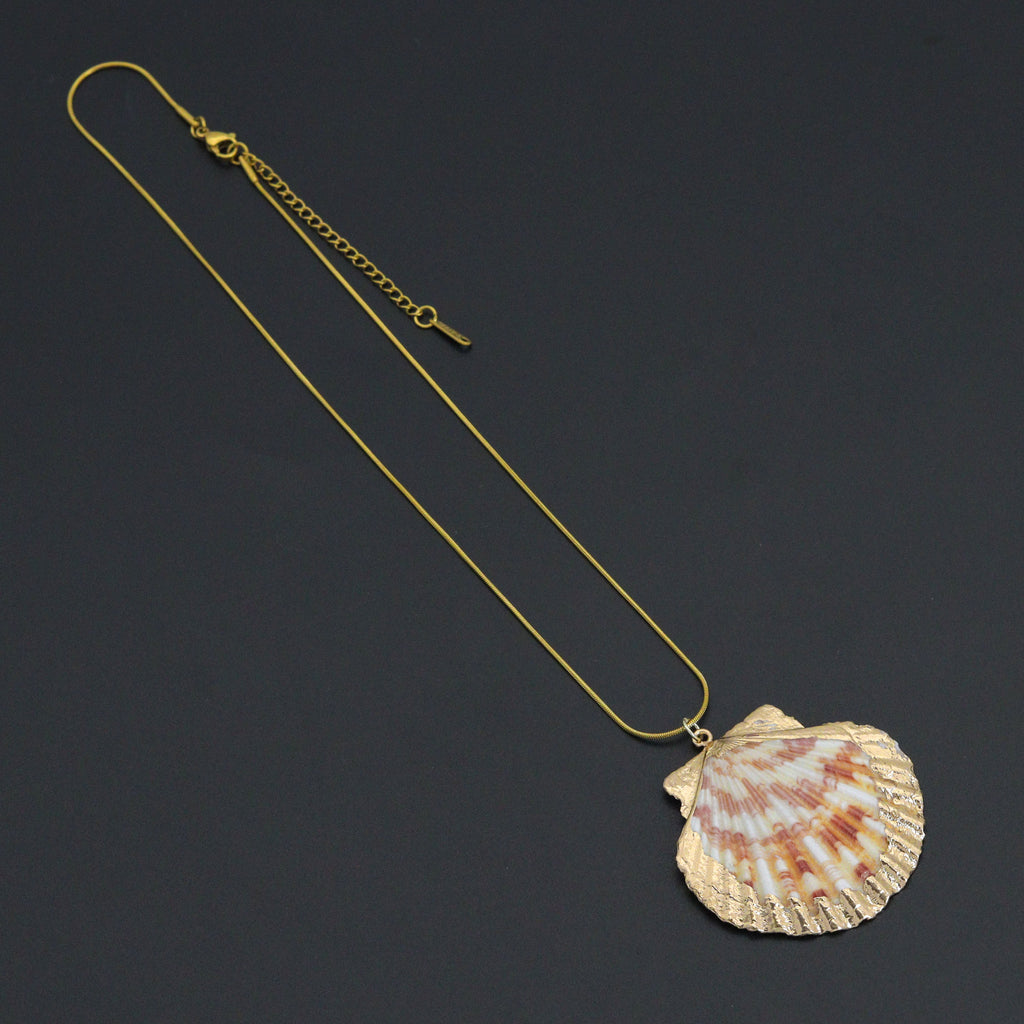 Scallop shell pendant with pink and cream markings and a gold-tone edge on a fine gold-tone necklace
