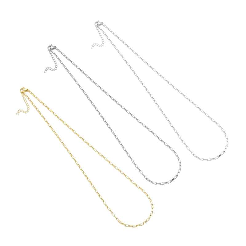 Three thin paperclip-link necklaces in gold-tone and silver-tone finishes