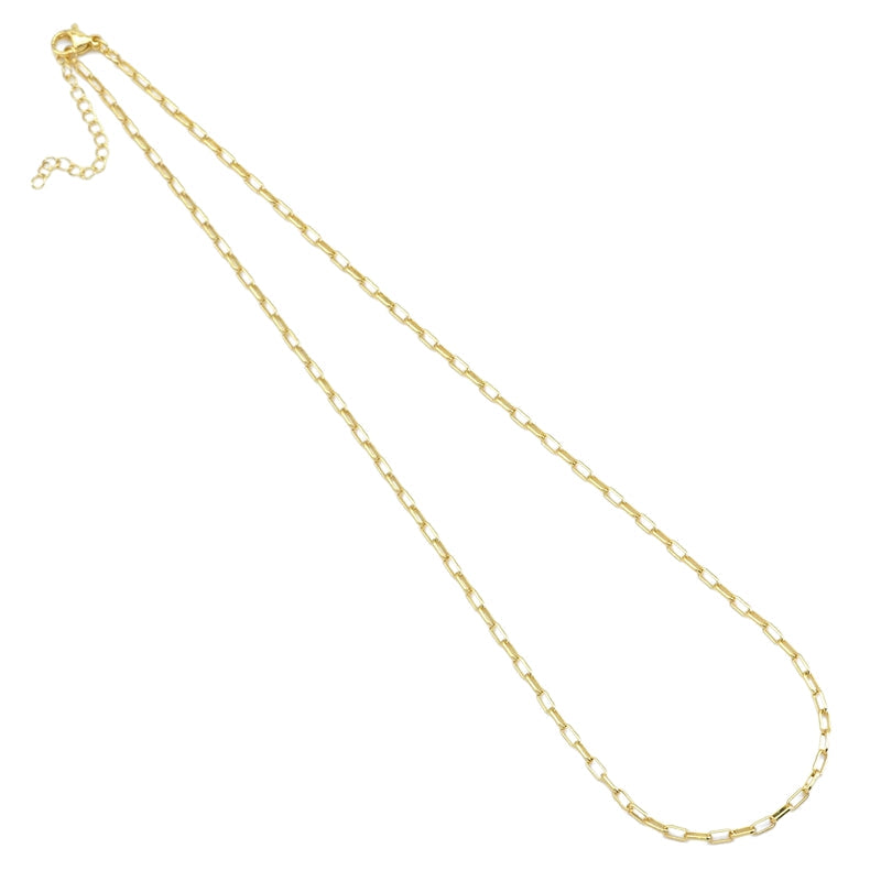 Thin gold-tone paperclip necklace with an extender on a white background
