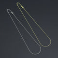 Gold-tone and silver-tone thin box chain necklaces with lobster clasps and extender chains