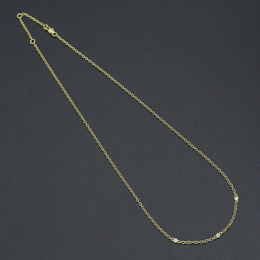 Dainty gold-tone link necklace with three round clear-stone bezel connectors