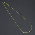 Dainty gold-tone link necklace with three round clear-stone bezel connectors