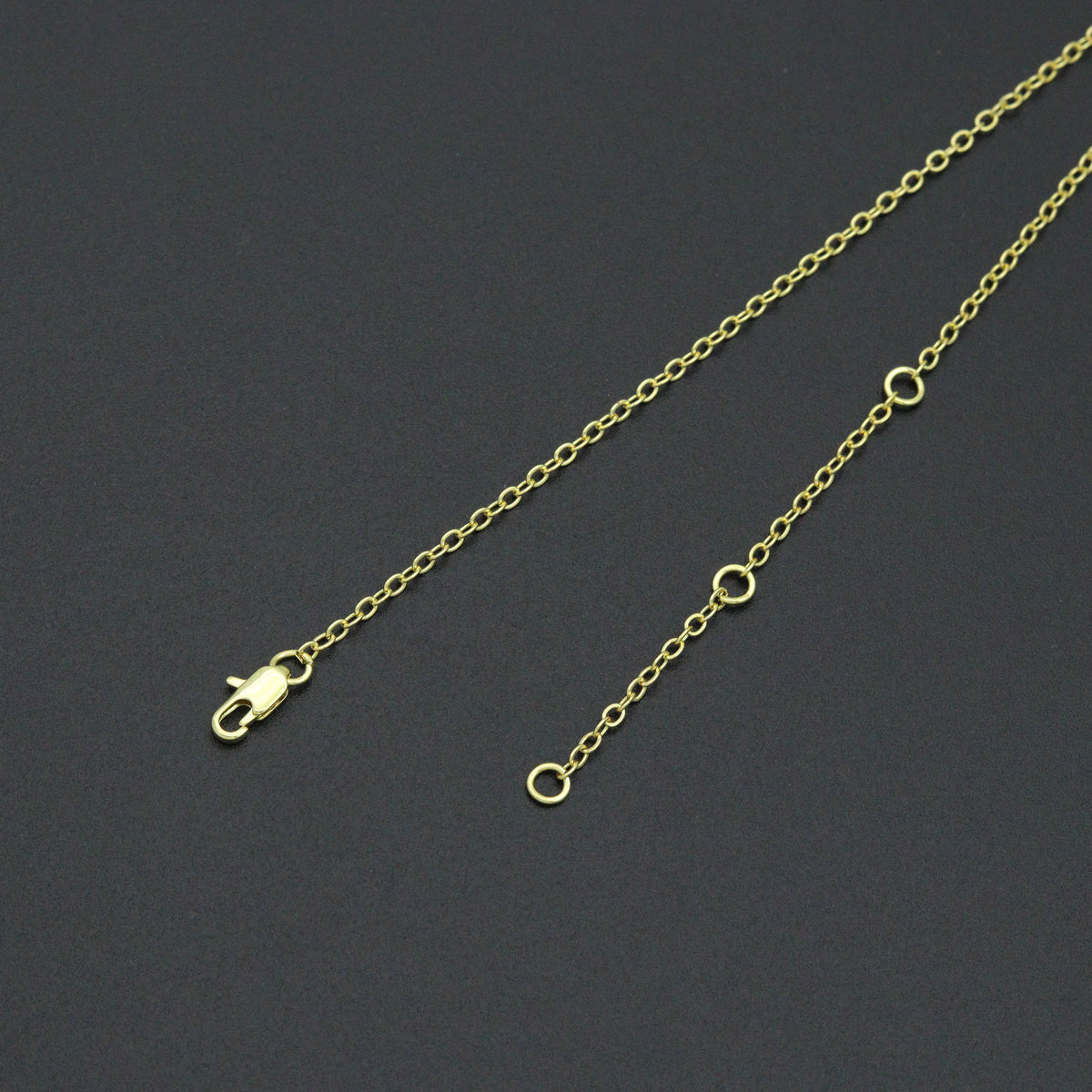 Gold-tone link necklace lobster clasp and three adjustment rings