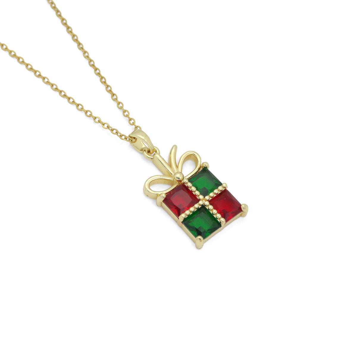 Close-up of the red and green gift-box pendant with a gold-tone bow