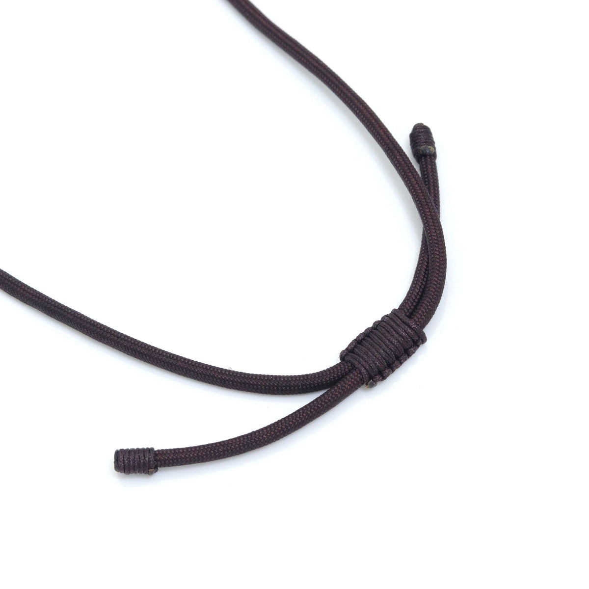 Close-up of an adjustable cord necklace sliding knot and finished cord ends