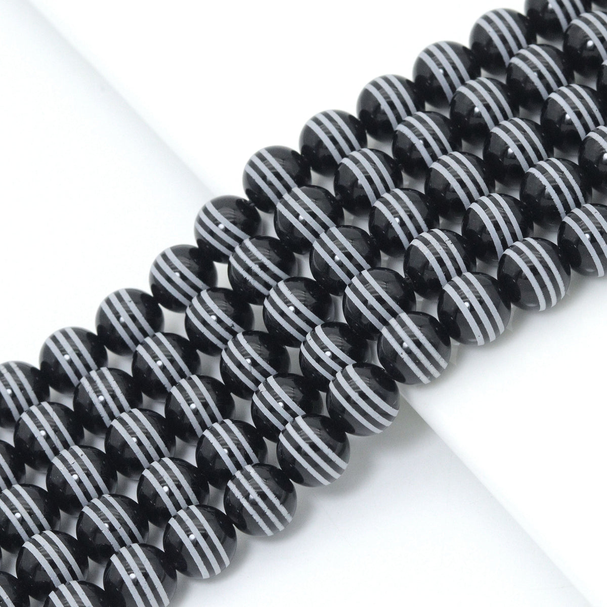 Black Onyx Smooth Round Beads with White Stripes, 10–14mm, 15–16-Inch Strand