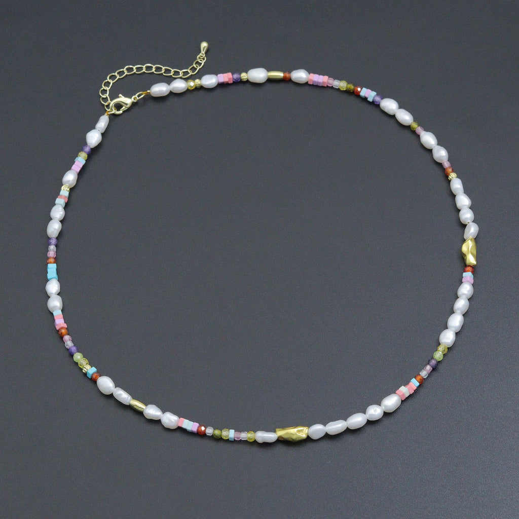 White pearl bead necklace with colorful small beads and gold-tone accents