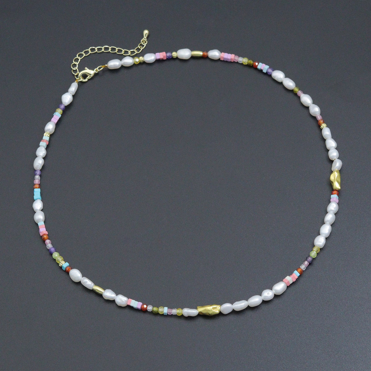 White pearl bead necklace with colorful small beads and gold-tone accents